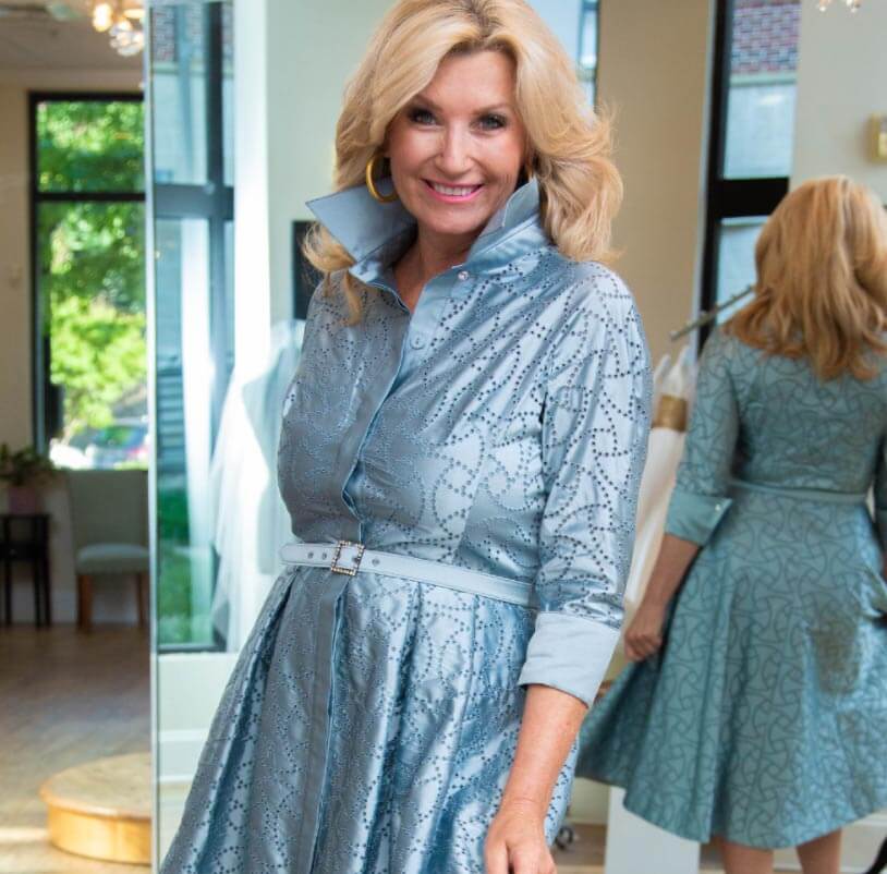 Model wearing a blue mothers Collection Gown