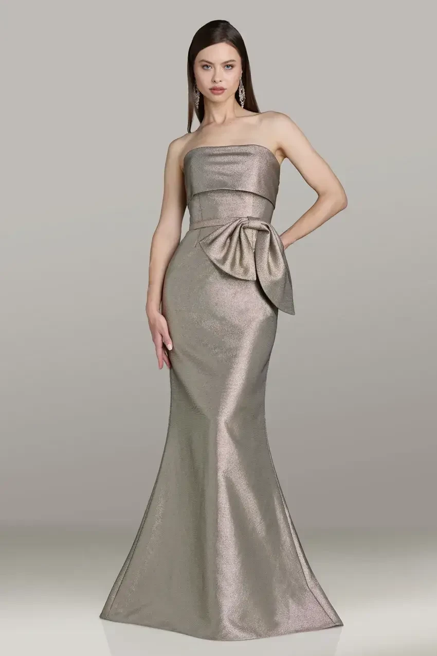 model is wearing a gold strapless mother of the bride gown