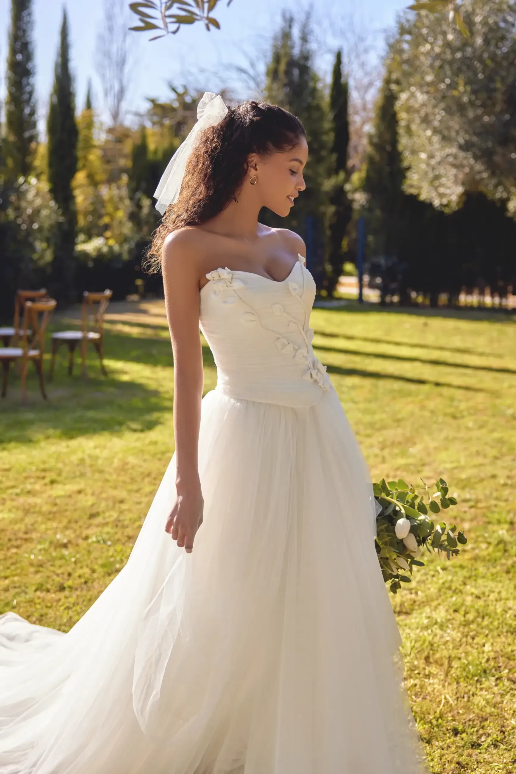 model wears a strapless a-line bridal gown
