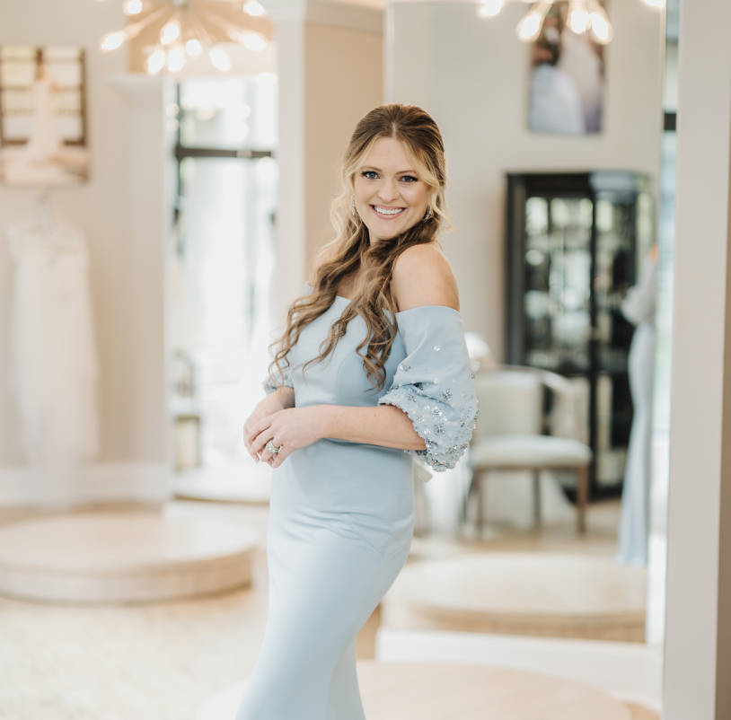 Model wearing a blue mothers Collection Gown