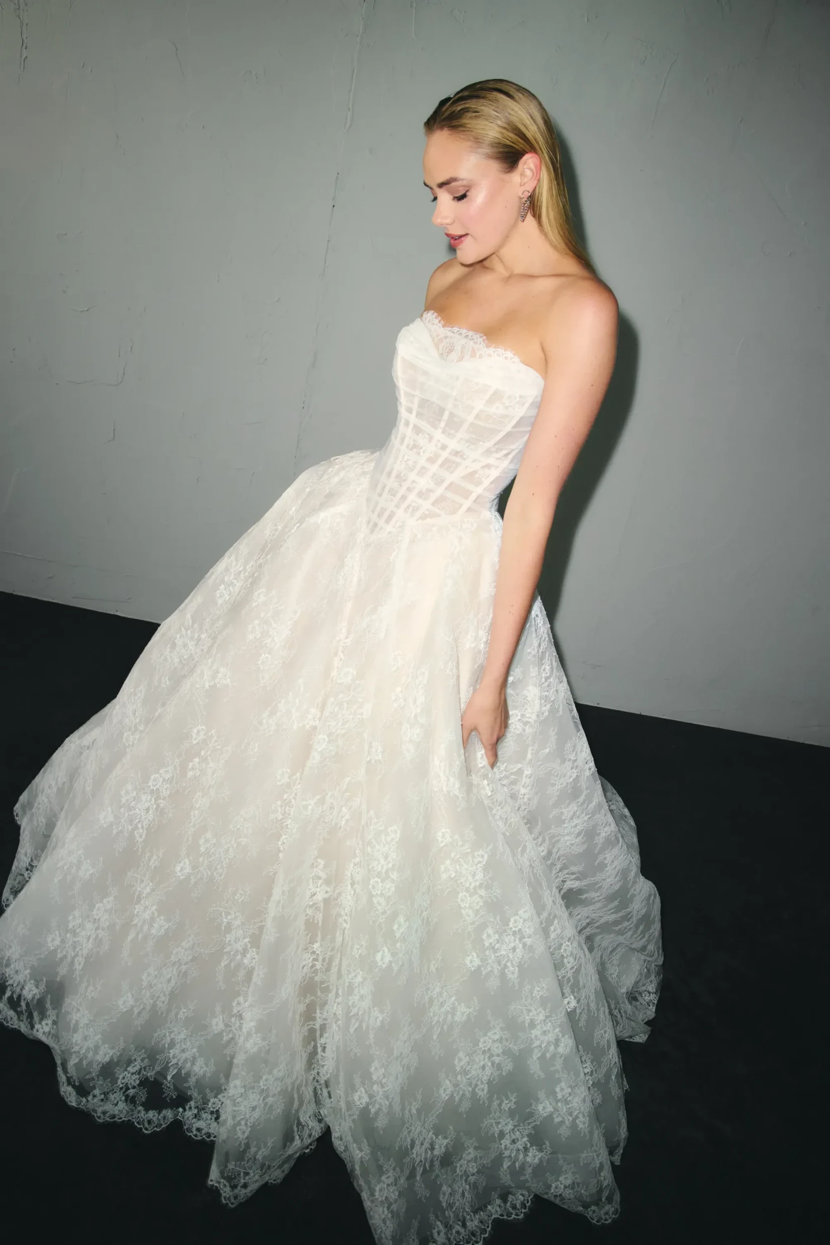 Model wearing a Justin Alexander Gown
