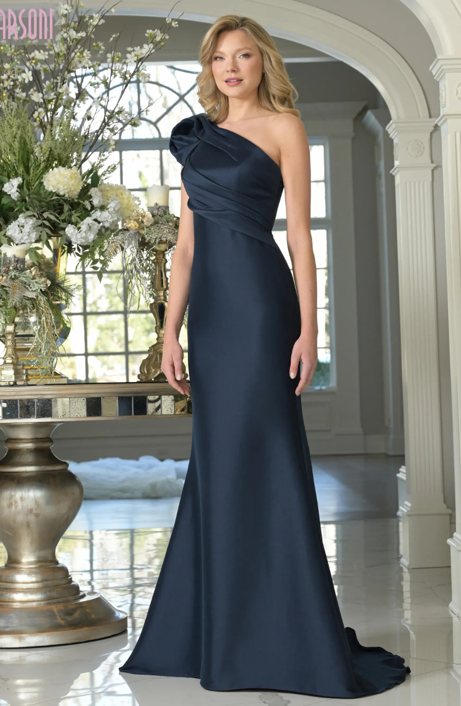 model is wearing an asymmetrical neckline navy blue mother of the bride dress