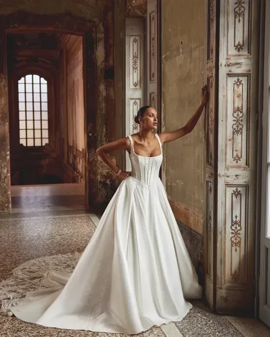 Model wearing a Justin Alexander Gown